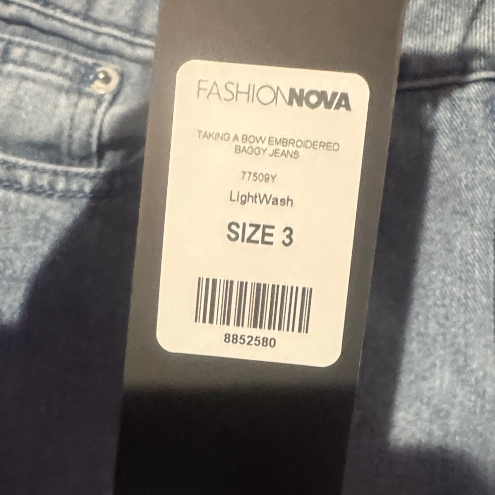 Stylish Blue Jeans with Pink Bow Detail - Picture 7 of 10